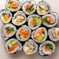 Top view of various sushi rolls.