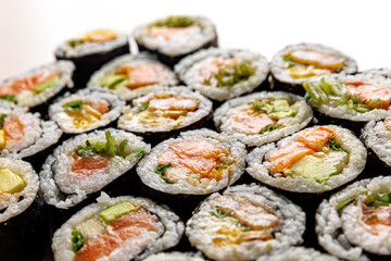 Top view of various sushi rolls.
