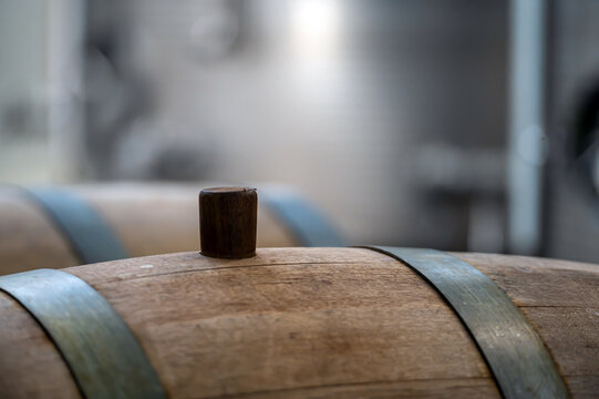 Wine barrel with wooden bung, closeup, selective focus