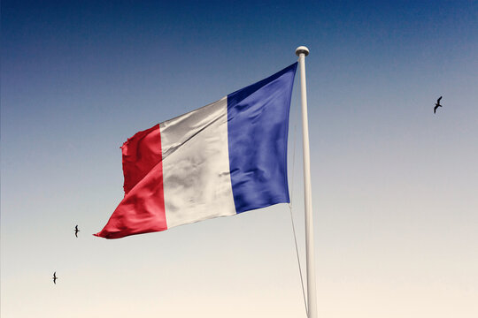 France flag fluttering in the wind on sky.