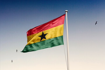 Ghana flag fluttering in the wind on sky. - obrazy, fototapety, plakaty