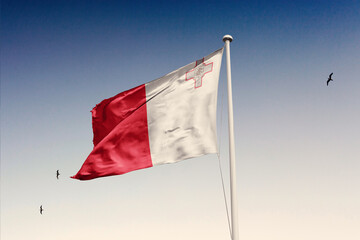 Malta flag fluttering in the wind on sky.