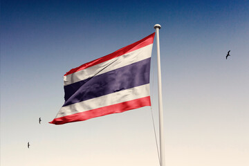 Thailand flag fluttering in the wind on sky.