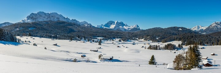 Fototapeta na wymiar panoramic landscape with mountains in snow at cold winter day