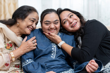 Family portrait with down syndrome woman at home