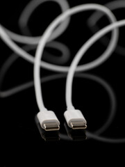 cable for charging a smartphone, data transfer, abstract on a dark background, web
