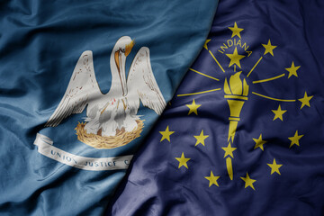 big waving colorful national flag of indiana state and flag of louisiana state .
