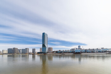 Fototapeta na wymiar Belgrade, Serbia - March 29, 2023: View at Belgrade Waterfront buildings at Sava river.