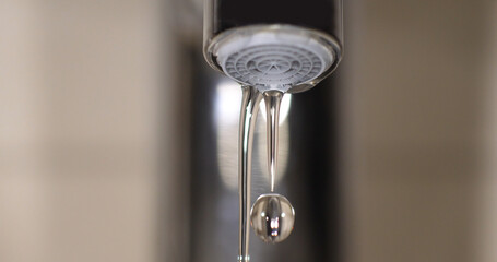 Water Flowing from the Tap, making a drop of water