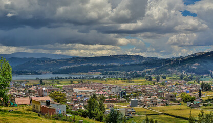 Obraz premium Colombian town of Paipa in Boyaca region, travel destination, natural light background copy space image, mountain range small town