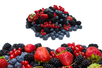 Blackberry, raspberry, blueberry,  red currant and mint background.