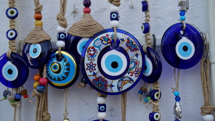Colorful evil eye beads hanging on the wall