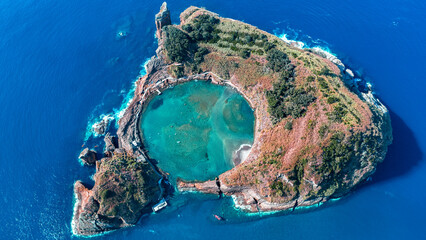 Drone shot of the small island of Ilhéu de Vila Franca do Campo on the Portuguese island of São...
