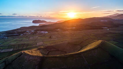 Sunset drone shot of the ancient Pico Dona Joana volcano on the Portuguese island of Terceira in the Azores