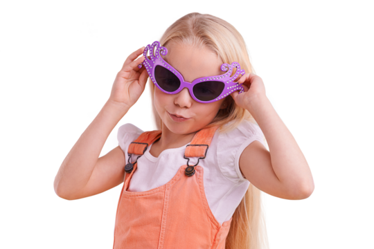 Happy, child fashion and silly sunglasses with kid and party accessory with youth and crazy eyeglasses. Laugh, comedy and girl isolated on a transparent, png background with funny glasses and cute