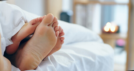 Feet, love and a couple sleeping in bed together for romance or bonding in their home in the...