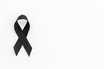 Black silk ribbon symbol of mourning and tragedy