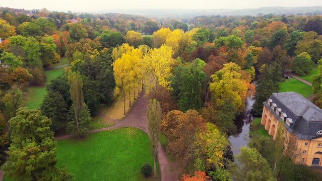 Lovely aerial top view flight drone. Weimar autumn park bridge landscape Germany