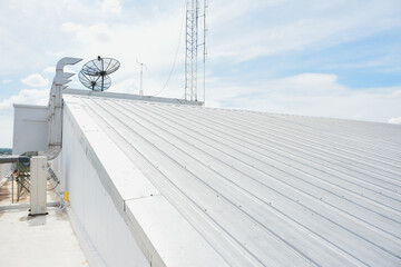 metal sheet roofing on commercial construction with blue sky