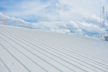 metal sheet roofing on commercial construction with blue sky