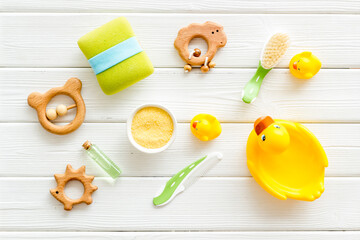 Baby shampoo and soap with yellow rubber duckling, top view