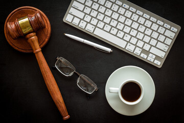 Law student or lawyer workplace with Judge gavel and coffee cup