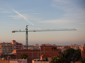 The Crane tower in construction site of a high-rise condominium.