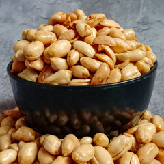 Kacang Goreng or fried peanuts which are given garlic seasoning with salty and savory flavor....