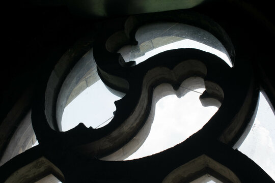 Triskelion on a stained glass window of a Christian church