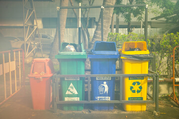 Color-segregated bins for proper waste separation