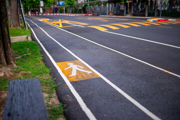 Obraz premium Pedestrian sign on the road in public park .