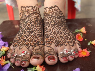Close up image of mehendi design on foot, selective focus 