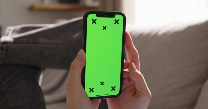 Unknown woman holds smartphone chroma key tracking points mockup. Advertisement app social media, online shopping. Tap at bottom of screen, buy online, submit an application, interact with phone app