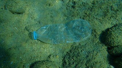 Plastic bottle underwater, Aegean Sea, Greece, Halkidiki. Sea pollution.
