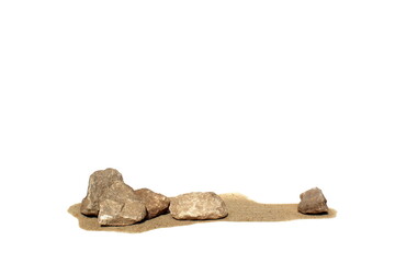 Dry sand and stones lie on a white background.	