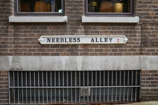 Birmingham, UK - Nov 5, 2023: Sign on the historic Needless Alley in Birmingham city centre