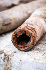 Detail shot with old and rusty drinking water pipes