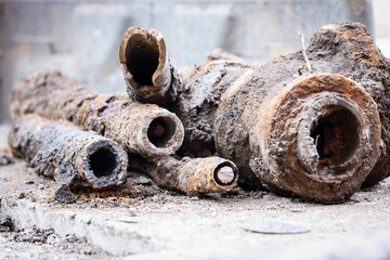 Detail shot with old and rusty drinking water pipes