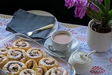 Chelsea buns with cup of tea