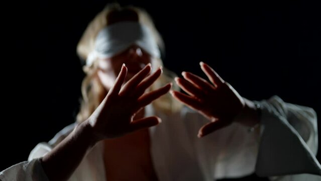 beautiful adult woman sleepwalking in darkness, dream and fantasy, lady with sleeping mask