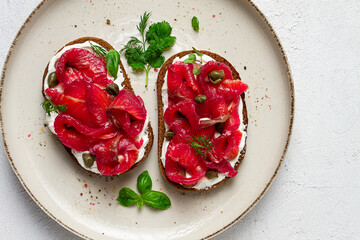 Sandwiches with gravlax salmon, cream cheese, capers, greens, breakfast, homemade,