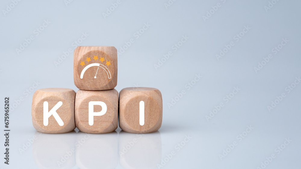 Poster wooden cube block with kpi short for key performance indicators on white background. business concep