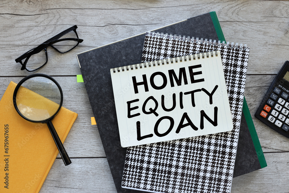 Poster home-equity loan. text on notepad page. workspace with folder and magnifying glass on yellow notepad