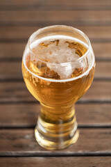 glass of beer on wooden table