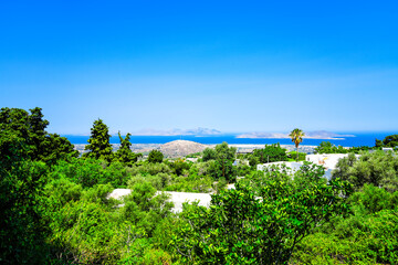 View of the landscape and the Mediterranean Sea from a mountain on the Greek island of Kos.	