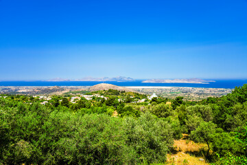 View of the landscape and the Mediterranean Sea from a mountain on the Greek island of Kos.	