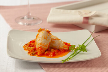A plate of squid stuffed with a delicious tomato sauce