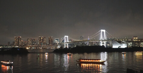 Fototapeta na wymiar Rainbow Bridge and Tokyo Bay at Night. Odaiba, Japan.