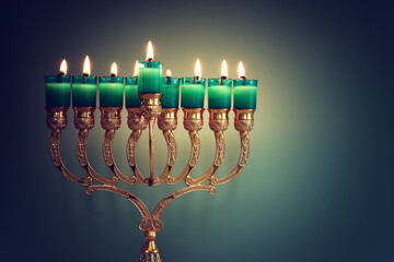Religion image of jewish holiday Hanukkah background with menorah (traditional candelabra) and oil...