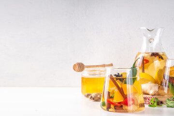 Fire cider, hot drink with apple cider vinegar, spices, herb and citrus slices. Organic raw natural flu and cold remedy drink, immune support, anti-inflammatory recipe